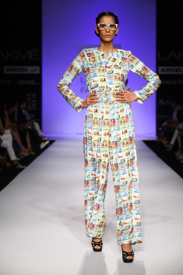 A silk jumpsuit with old Indian postal stamp print.
